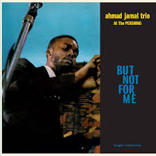 Album cover of "Ahmad Jamal Trio - But Not For Me" by Tandem Coffee Roasters. It features a close-up of Ahmad Jamal playing the piano, with the album title and artist's name on a split blue and black background. This iconic cover captures tracks like "But Not For Me" and "Moonlight In Vermont.