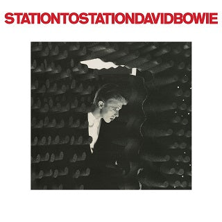 David Bowie - Station to Station album cover by Tandem Coffee Roasters showcases a striking black and white image of David Bowie in profile, positioned within a futuristic, dark set design. A bright light illuminates his face, highlighting his distinct features. The album title is prominently displayed in bold red capital letters at the top, creating a visually impactful parallel to the Theory of Art.