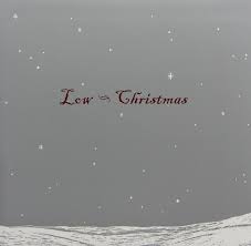 Album cover of "Low - Christmas" featuring a minimalist snowy landscape under a gray sky with gentle snowfall and the text "Tandem Coffee Roasters" in red script at the center.