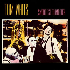 The cover of Tom Waits' "Swordfishtrombones" album features a stylized image of three people, one with a painted face, posed amid abstract elements. A tuba hints at the whimsical soundscape akin to "Shore Leave," with "TOM WAITS" and "SWORDFISHTROMBONES" at the top. Product by Tandem Coffee Roasters.